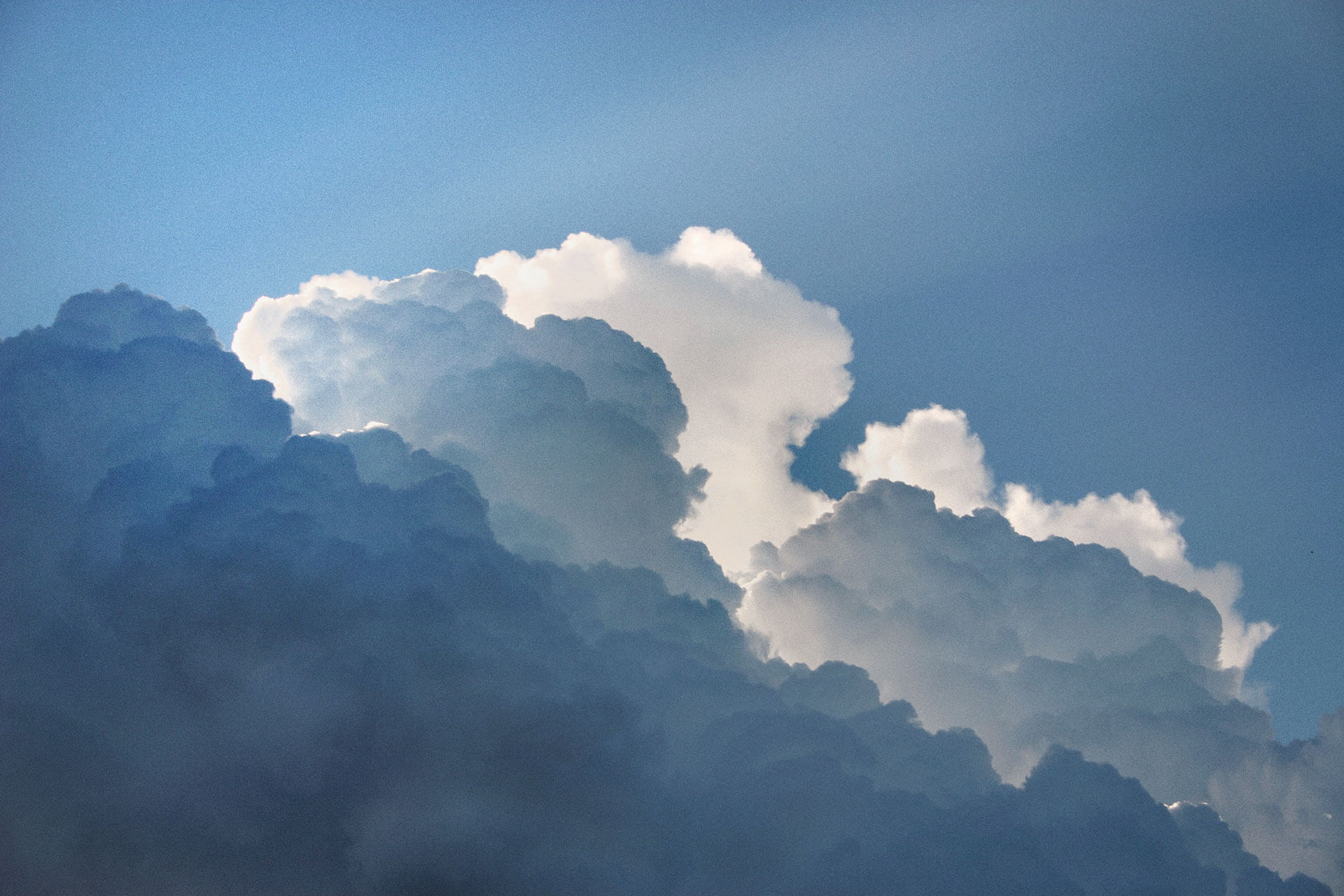 A relaxed businessman enjoying a break in his bright, contemporary office environment.